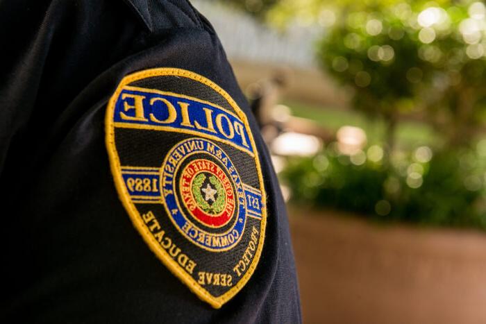 University police badge on officer uniform.